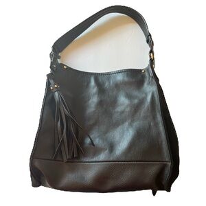 Sondra Robert’s squared. Black with a tassel on it and zippers on the sides.